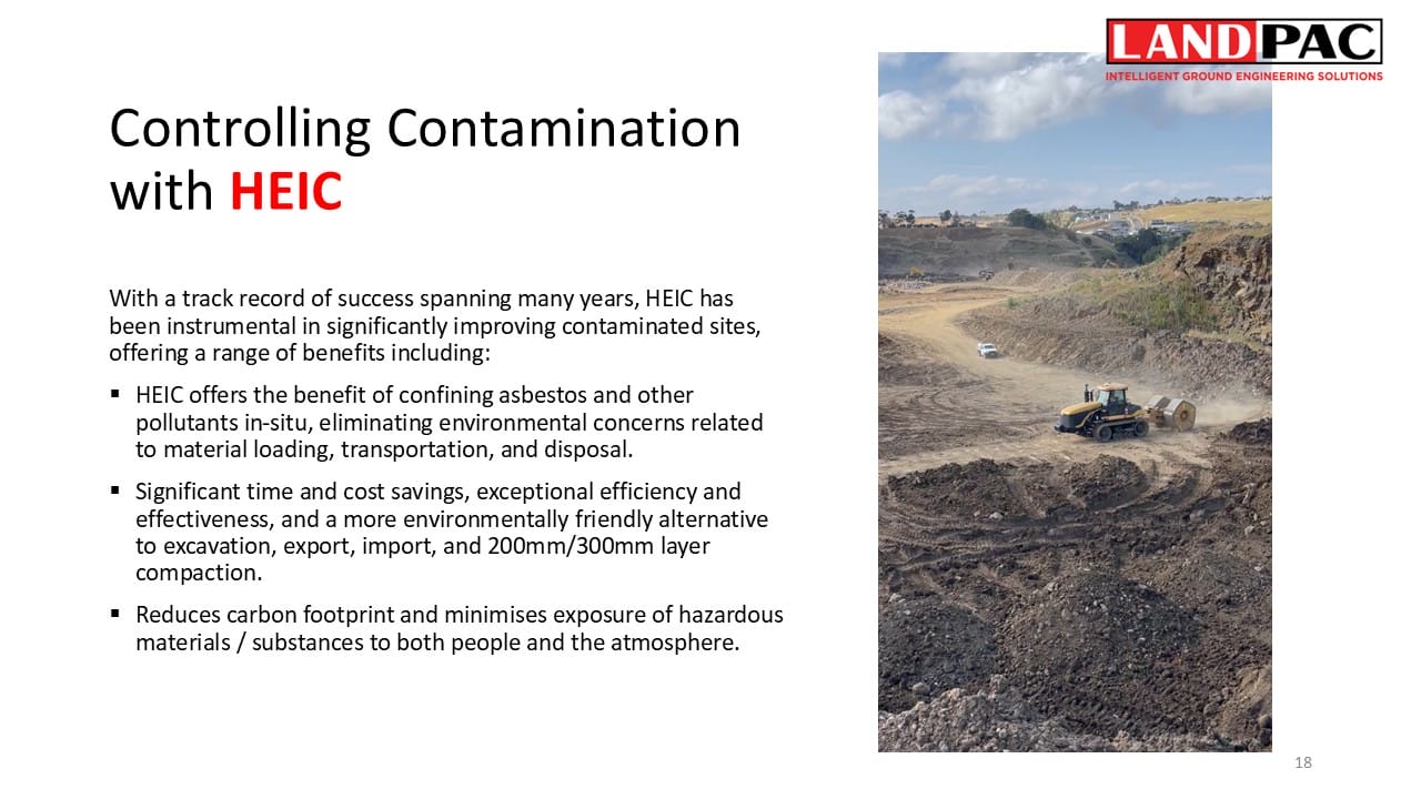 A bulldozer works at a large, open construction or landfill site under a partly cloudy sky.